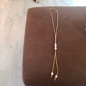 Slip on choker with pearl beads.